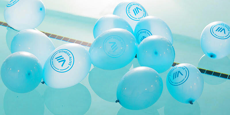 Fitness Alive balloons floating in the pool