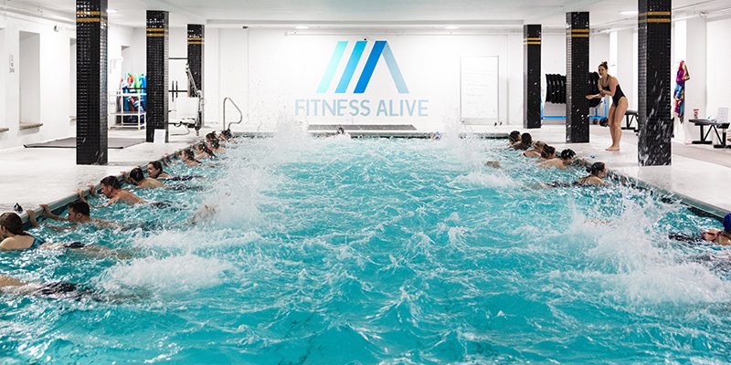 Swimmers kicking off the wall in the Fitness Alive lap pool